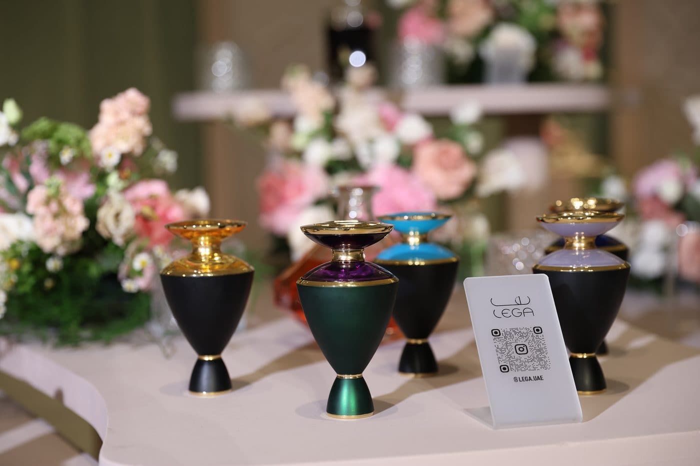 Gold and black incense cups beside the Lega card