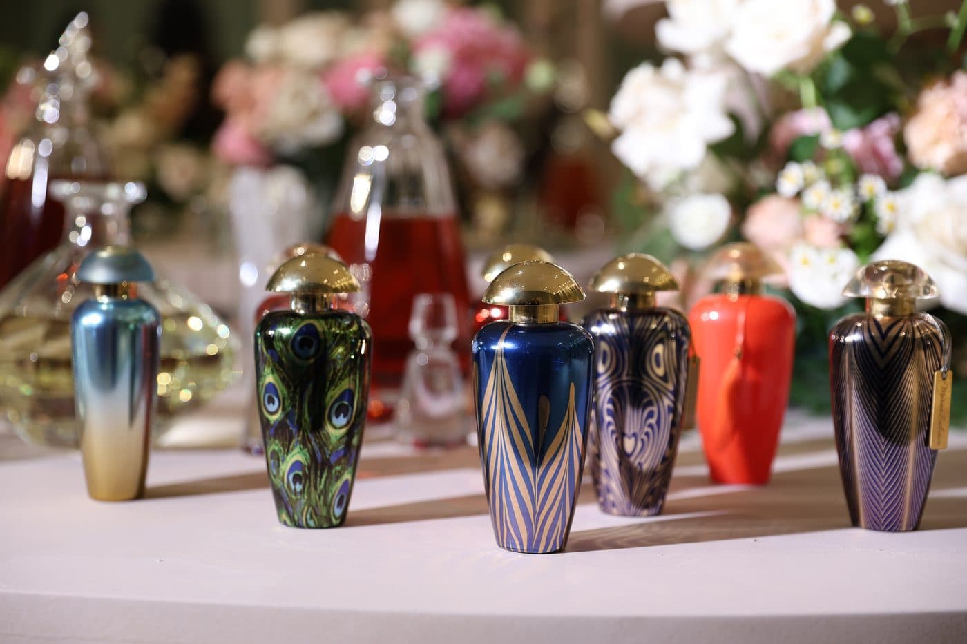Hand-blown perfume bottles on the Lega table